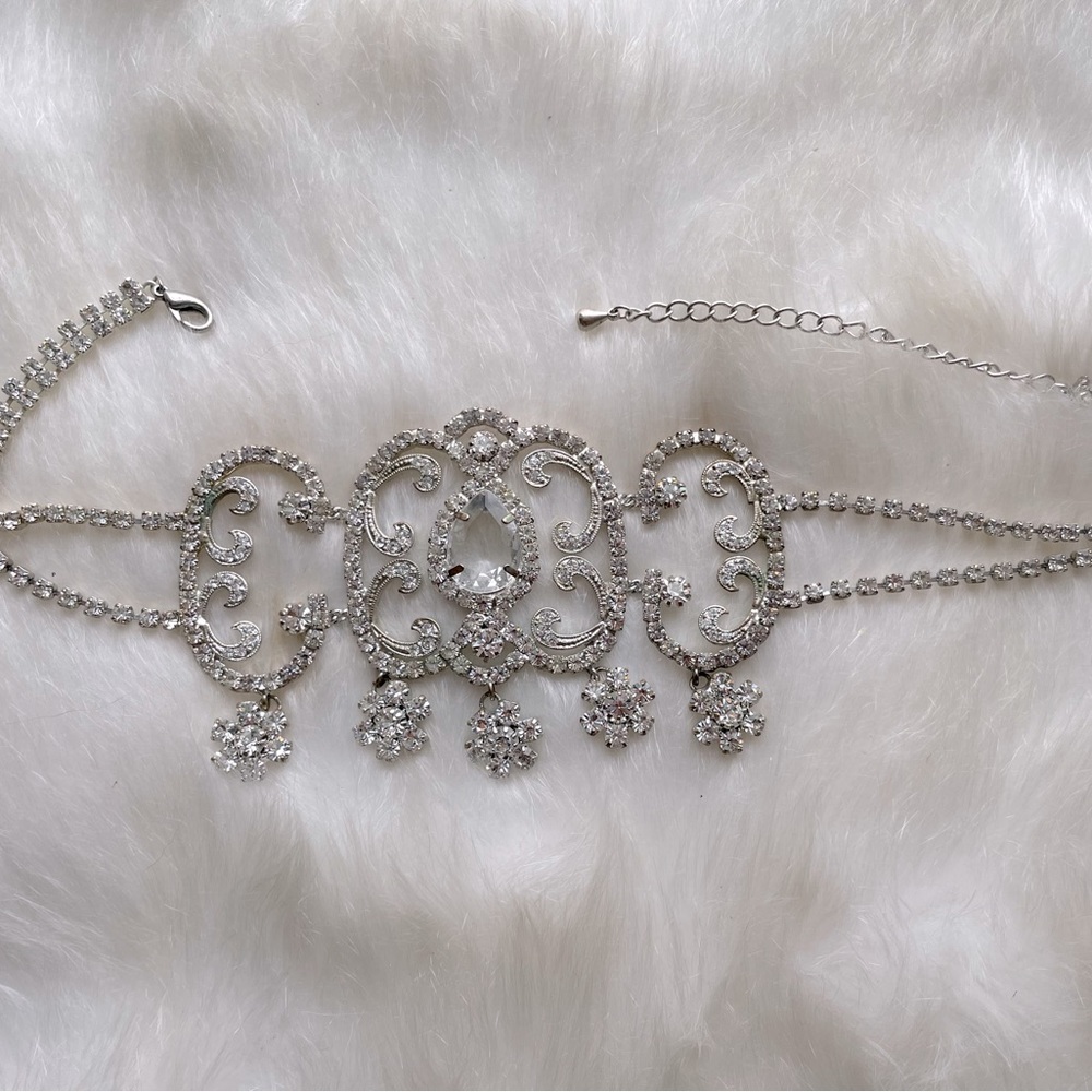 Prom jewelry. Ornate silver and diamond look choker. Worn one time.
